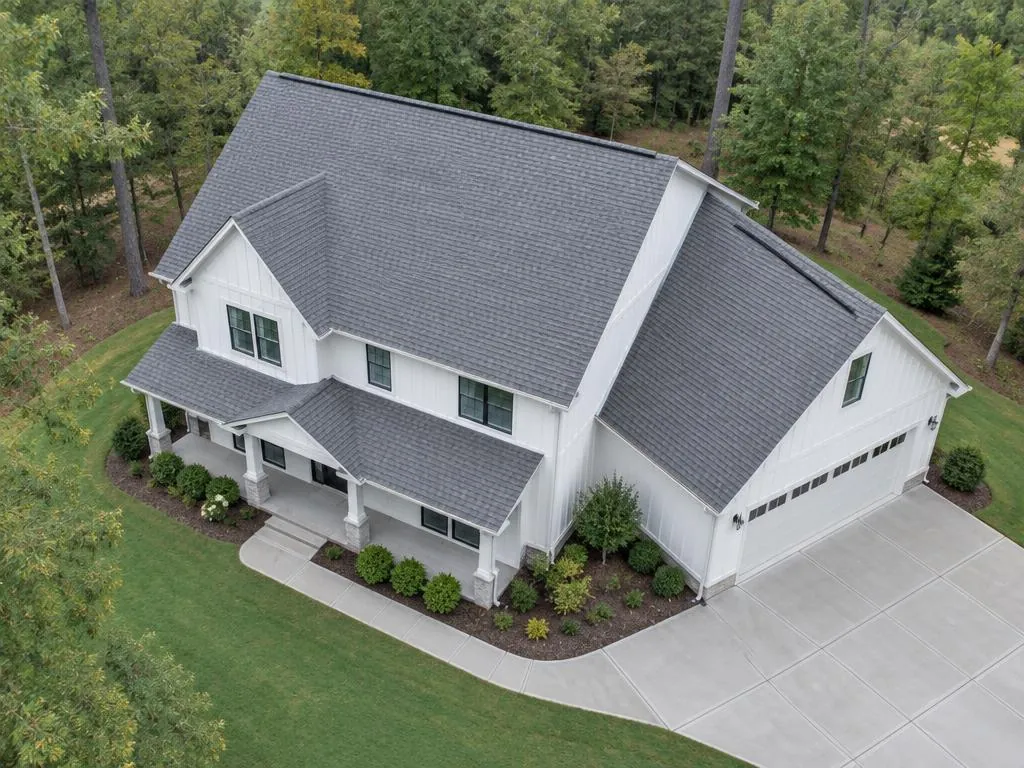 AI aerial illustration of a white Georgia-style home with a broad gray gable roof and garage wing