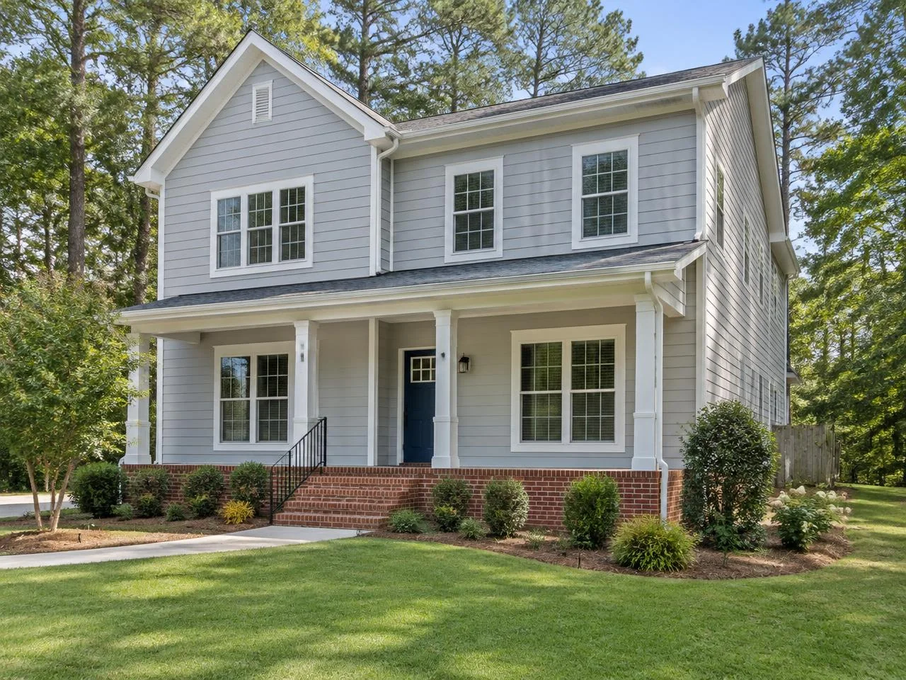 Generated view of pale gray lap siding and white trim on a Georgia-style two-story home